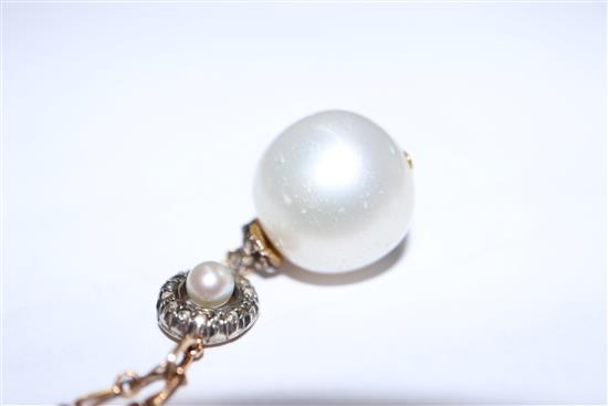 A yellow metal, rose cut diamond and cultured pearl set drop pendant, on a yellow metal chain, pendant approx. 28mm.